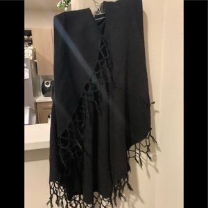 Black OS poncho with arm holes.